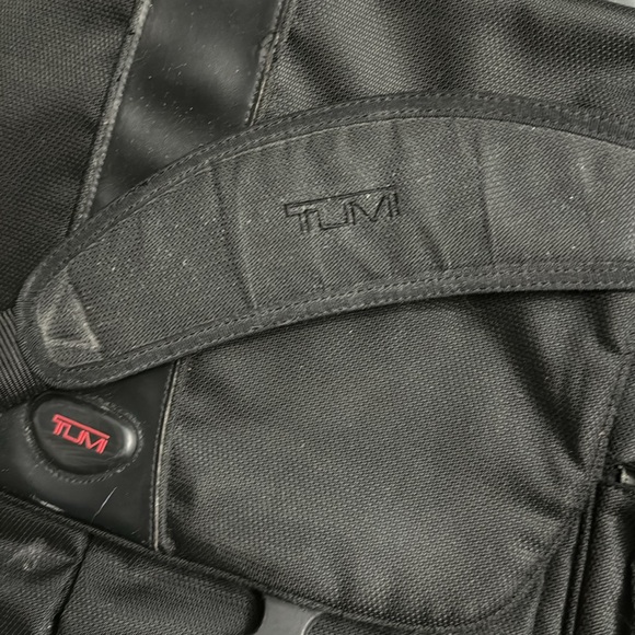 Used Tumi fabric computer bag. The handle has been worn. all the zippers work. - Picture 5 of 5